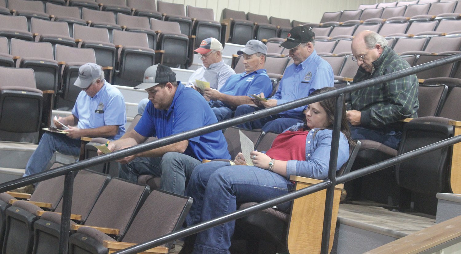 Several USDA officials during a semi-annual meeting held at the Wright County Livestock Auction locatoin.
